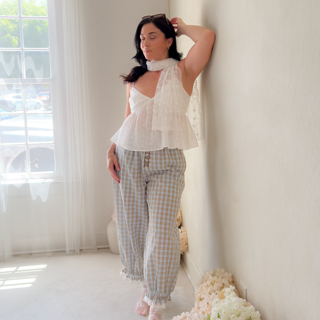 Feminine balloon pants outfit for women featuring blue gingham pants, lace socks, and romantic soft summer styling.