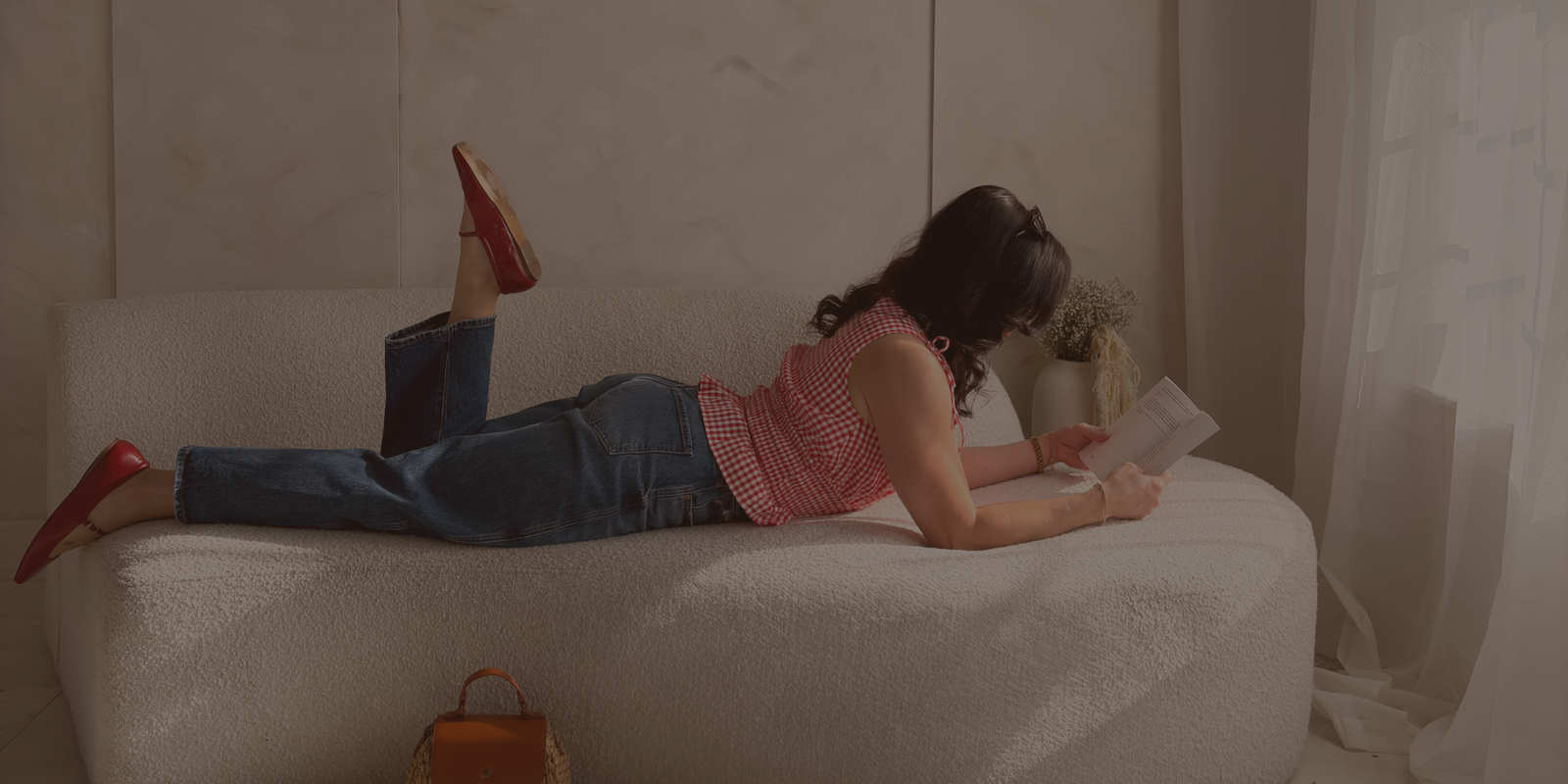 Woman wearing a red gingham top, blue jeans, and red mary jane flats styled for a feminine spring outfit from the Blooming Daily Spring Storybook Collection