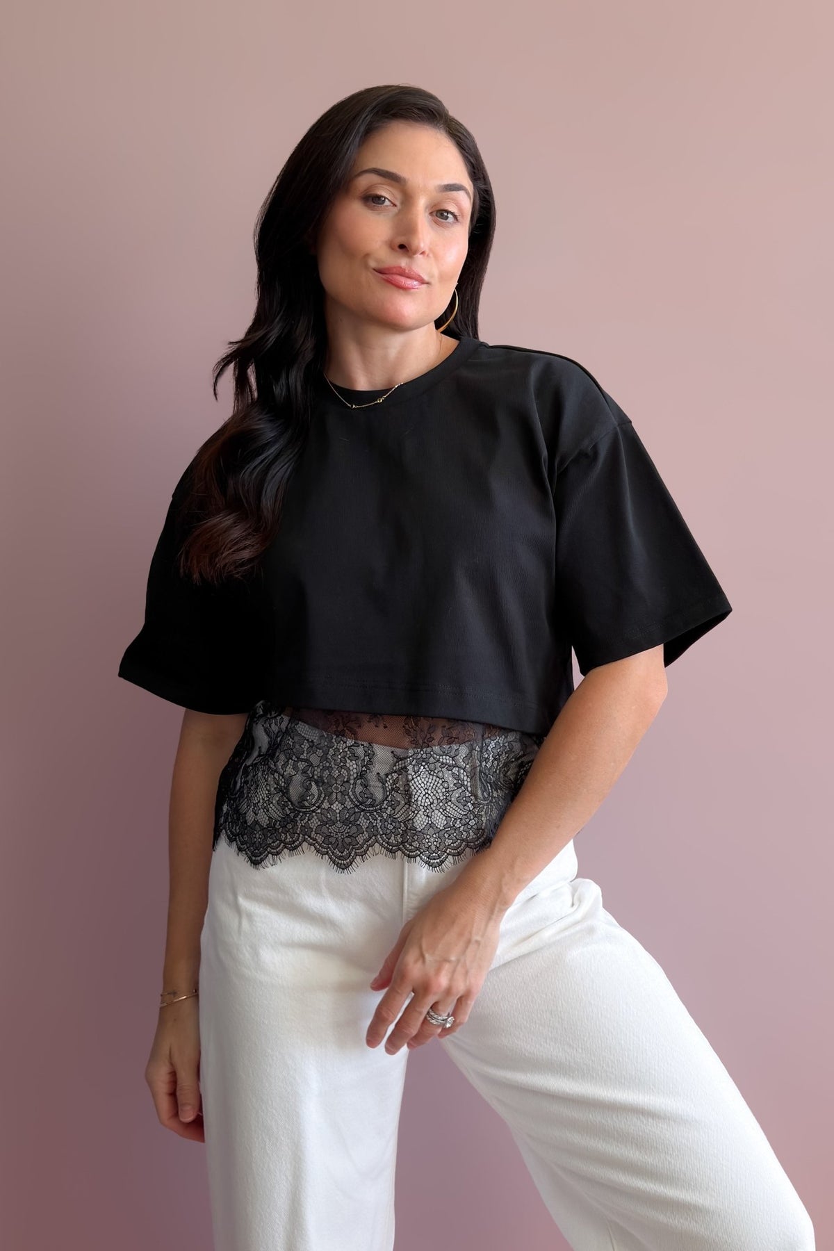Women’s black structured T-shirt with sheer lace hem and relaxed drop shoulder fit