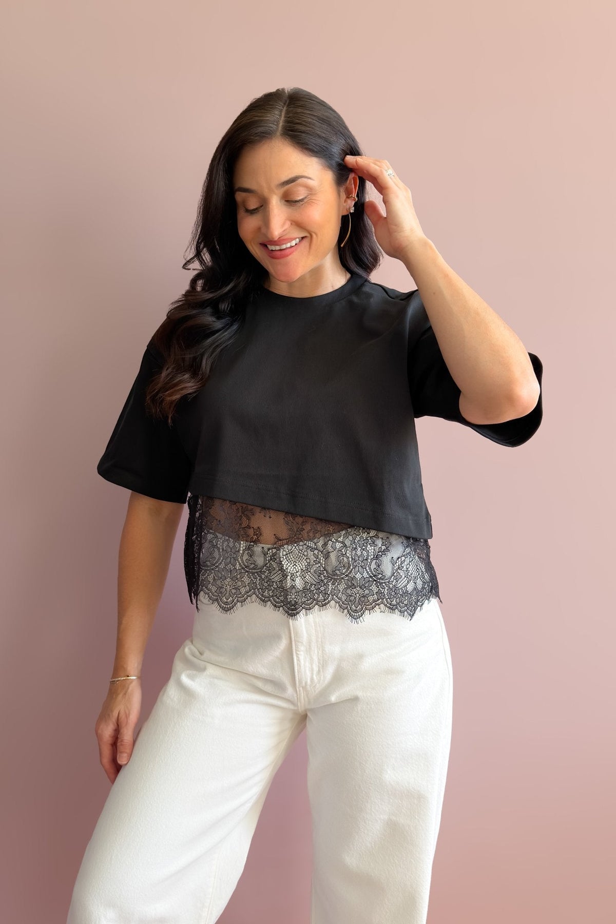 Black asymmetrical lace hem tee with substantial cotton fabric and romantic floral detail