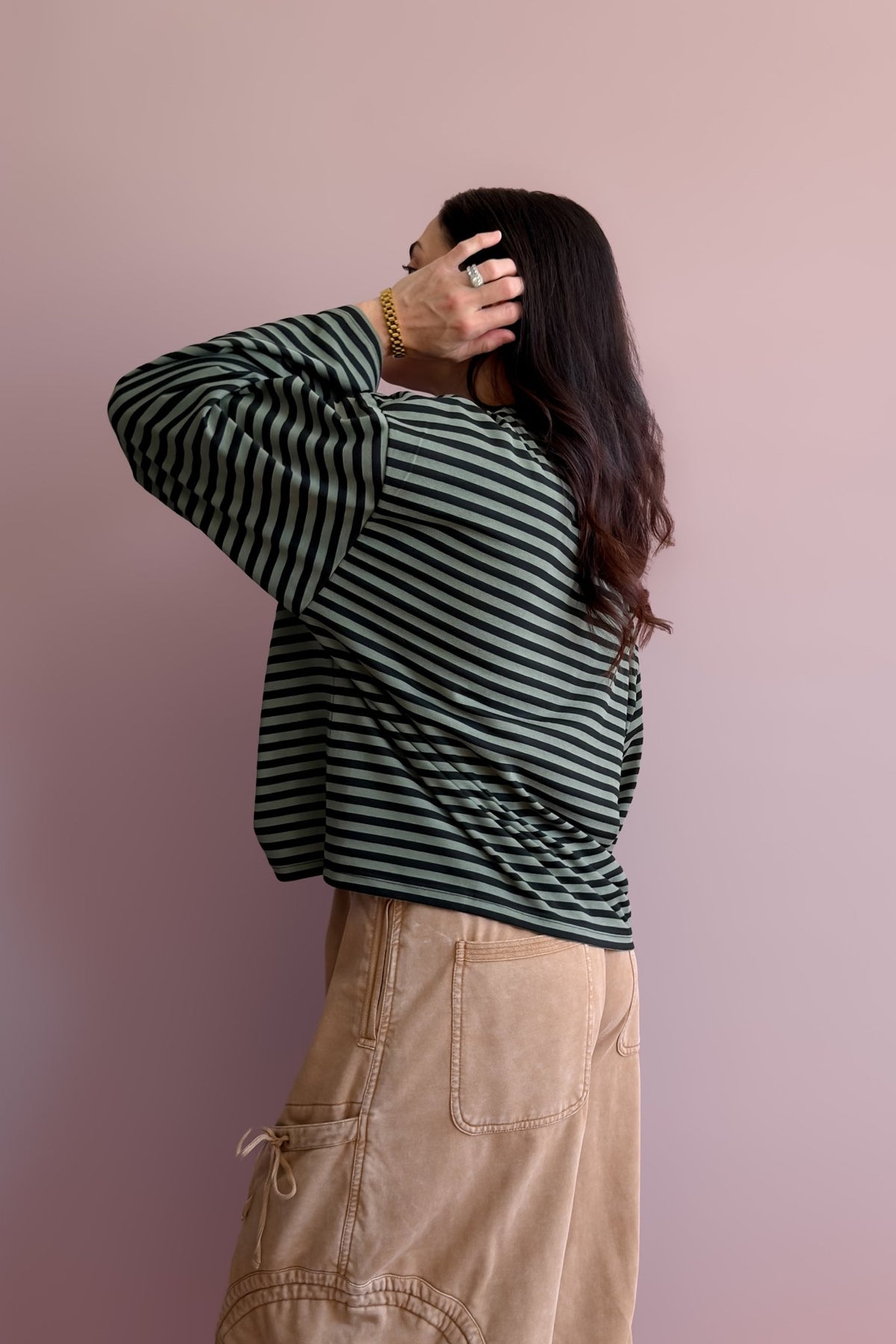 Women’s striped long sleeve tee with muted olive stripes, black trim and drop shoulders