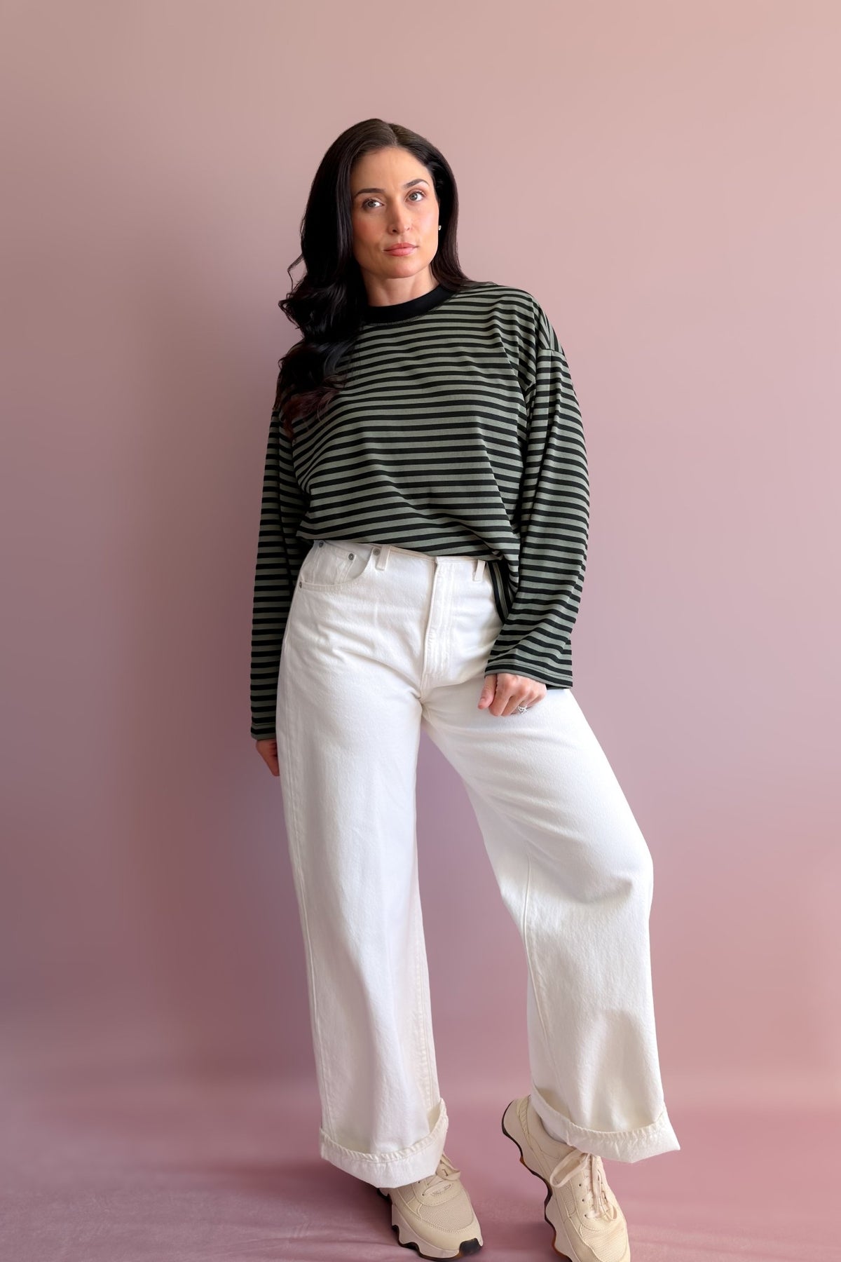 Olive green and black striped crewneck tee styled with relaxed tan cargo pants