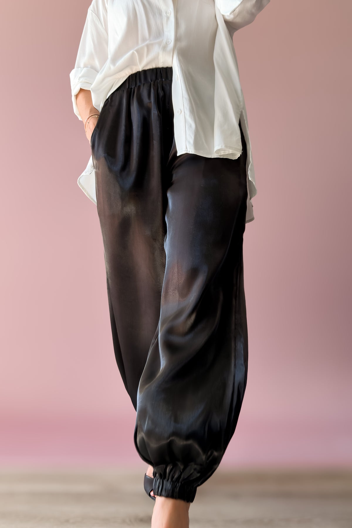 Double-layered black organza pants with relaxed fit and elasticized ankle