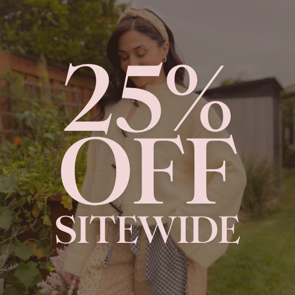 Labor Day sale graphic for Blooming Daily featuring a model in a cream sweater and patchwork pants with large pink text reading “25% Off Sitewide.