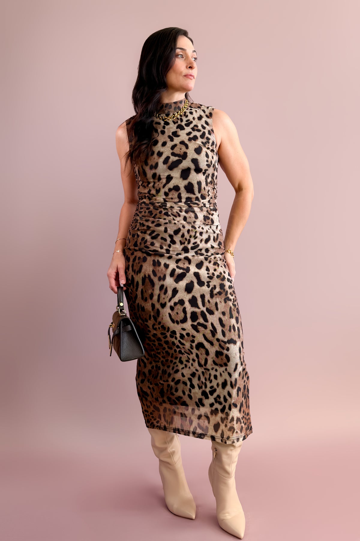 Front view of brown leopard print bodycon midi dress with ruched waist detailing.