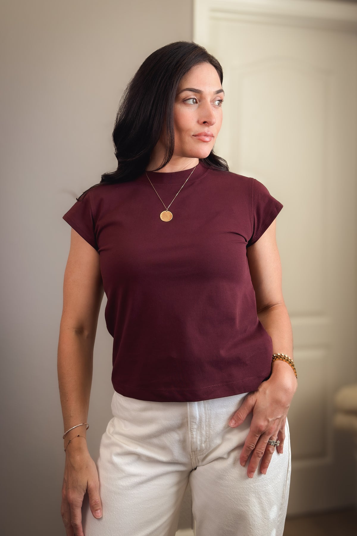 Women’s burgundy crewneck T-shirt with flattering cap sleeves and a softly structured everyday fit.