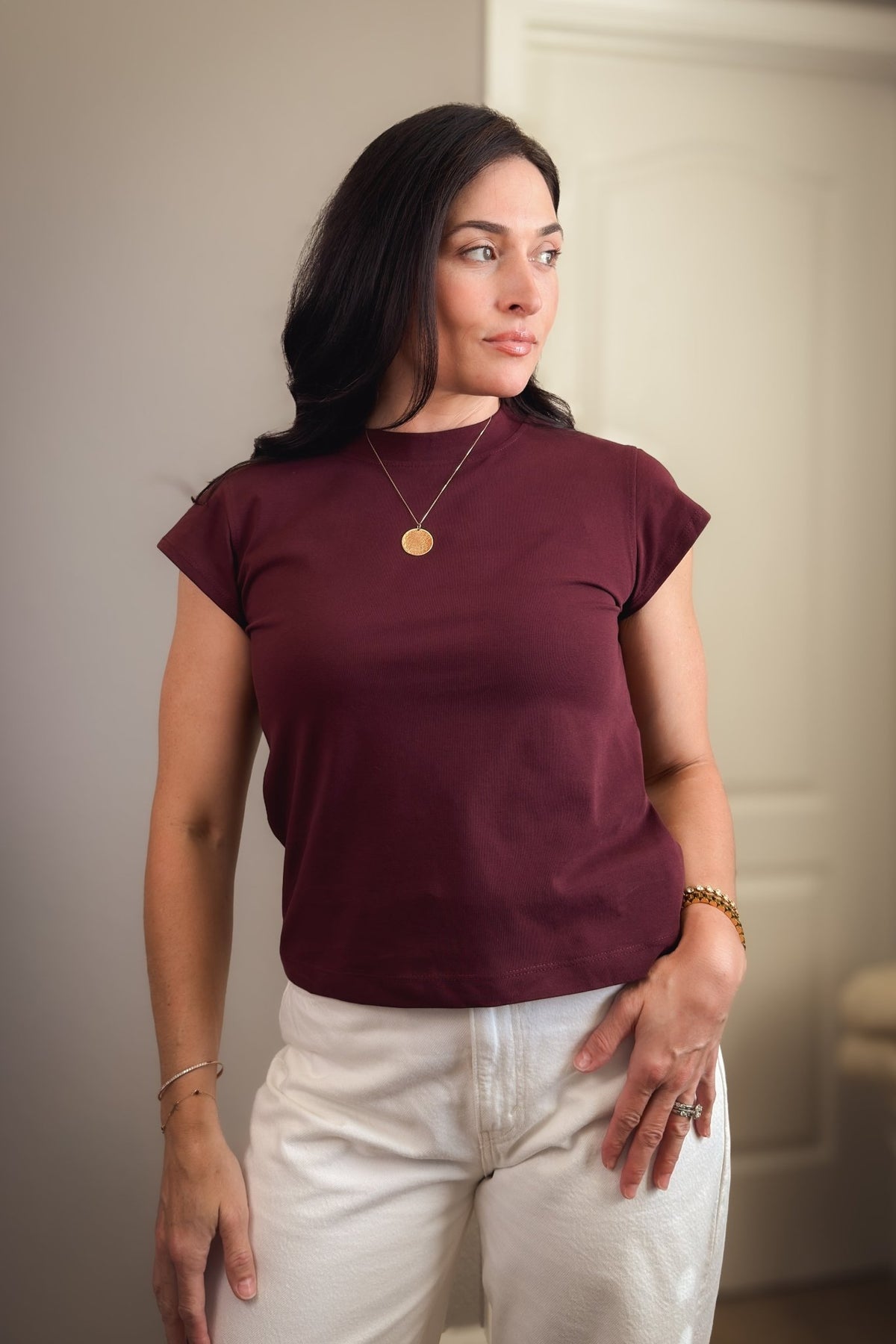 Women’s burgundy crewneck T-shirt with flattering cap sleeves and a softly structured everyday fit.