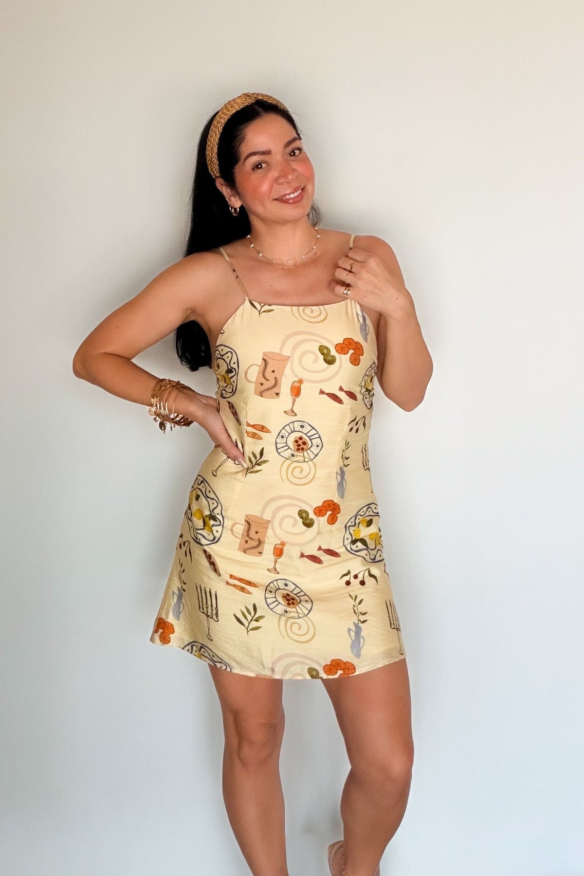 Front view of the Butter Yellow Printed Mini Dress featuring a square neckline and colorful Mediterranean-inspired print.