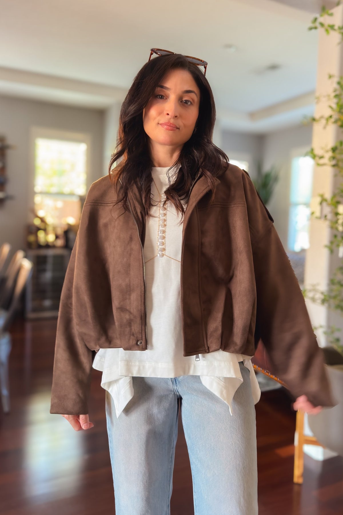 Women’s chocolate brown faux suede jacket with lightweight lining, roomy sleeves and an effortless oversized fit.