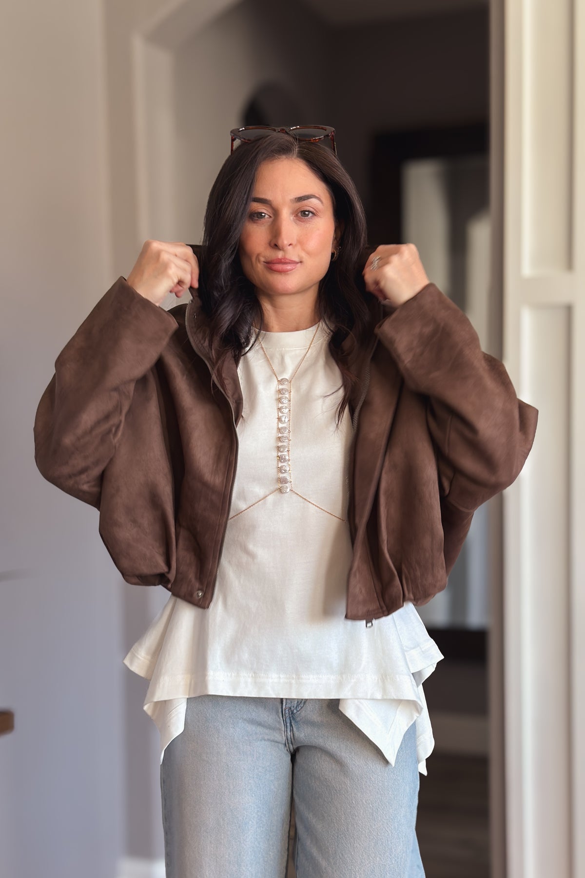 Women’s chocolate brown faux suede jacket with a lightweight fully lined design and soft oversized silhouette.