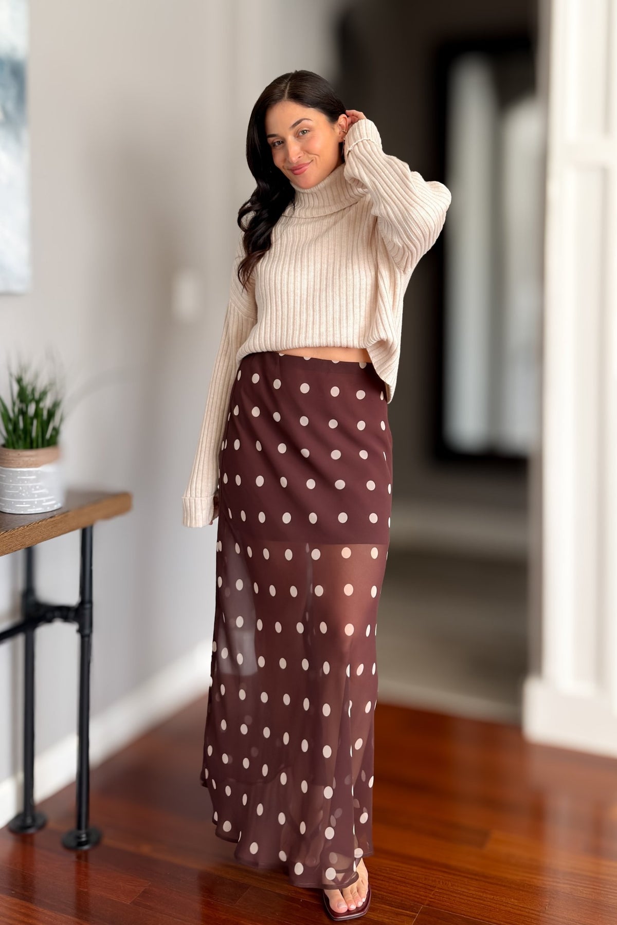 Brown sheer maxi skirt with classic polka dot print styled for an elevated fall and winter outfit