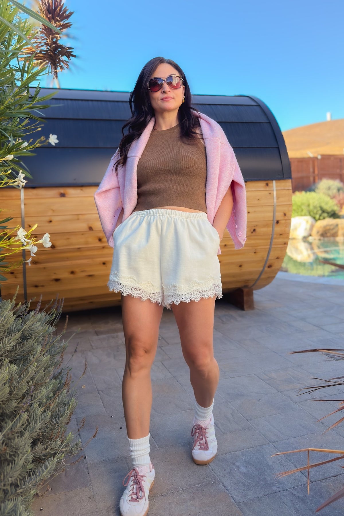 Women’s cream cotton shorts with elastic waistband, side pockets and delicate lace trim