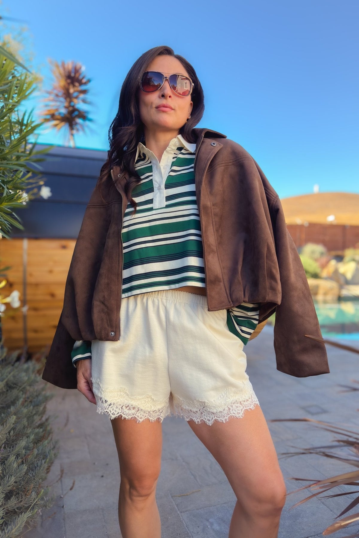8. Ivory cream cotton French terry shorts with lace trim styled for a casual feminine outfit