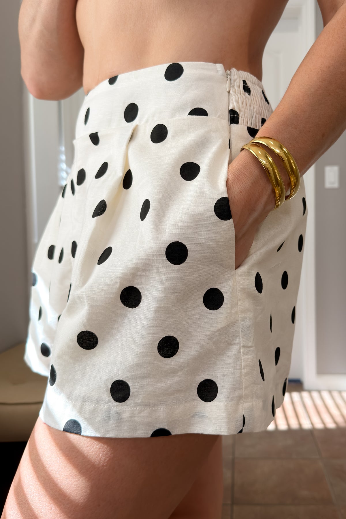 Lightweight cream matching set featuring a linen blend peplum top and coordinating shorts for vacations, brunch, and everyday wear.