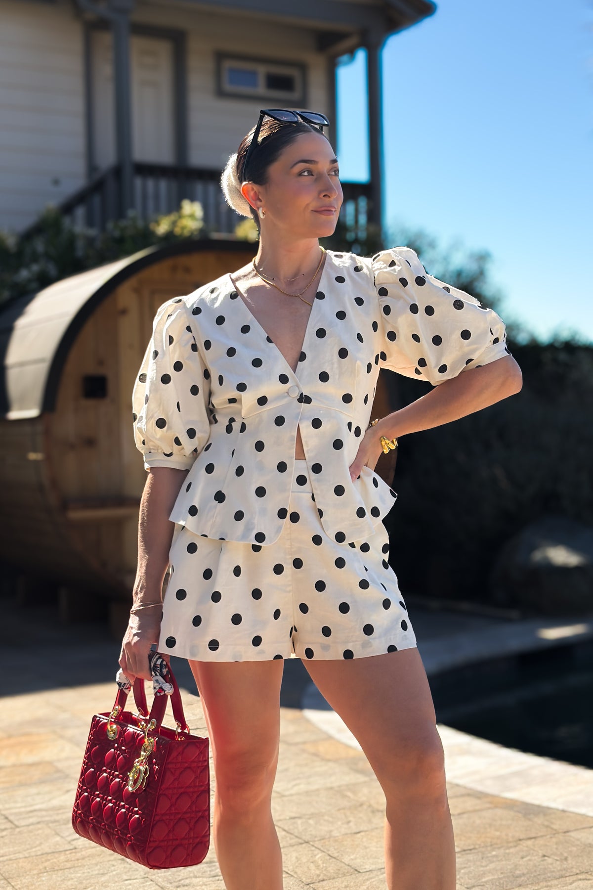 Cream linen blend matching short set featuring a feminine peplum top, black polka dot print, and lightweight breathable fabric.