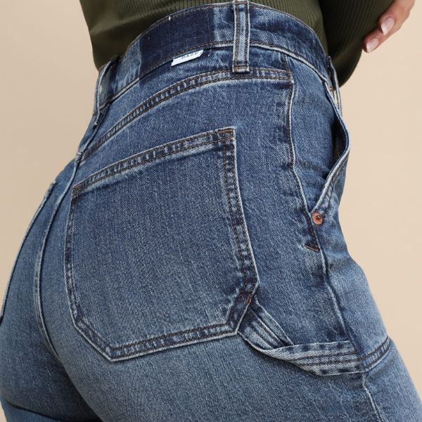 A model wearing a pair of daze denim carpenter pants