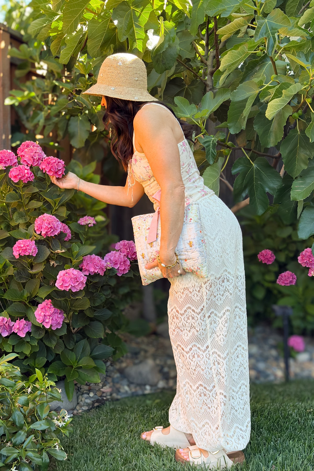 Floral quilted Bible cover with decorative pink bow and padded construction, perfect for protecting a full-size Bible during travel or church.