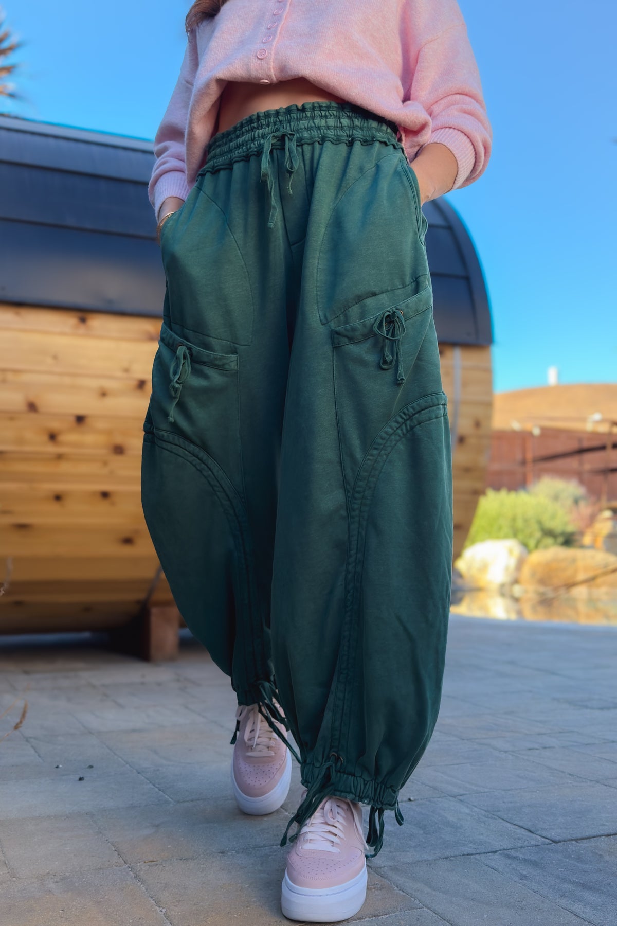 Women’s green drawstring cargo pants with garment-dyed mineral wash finish and loose fit