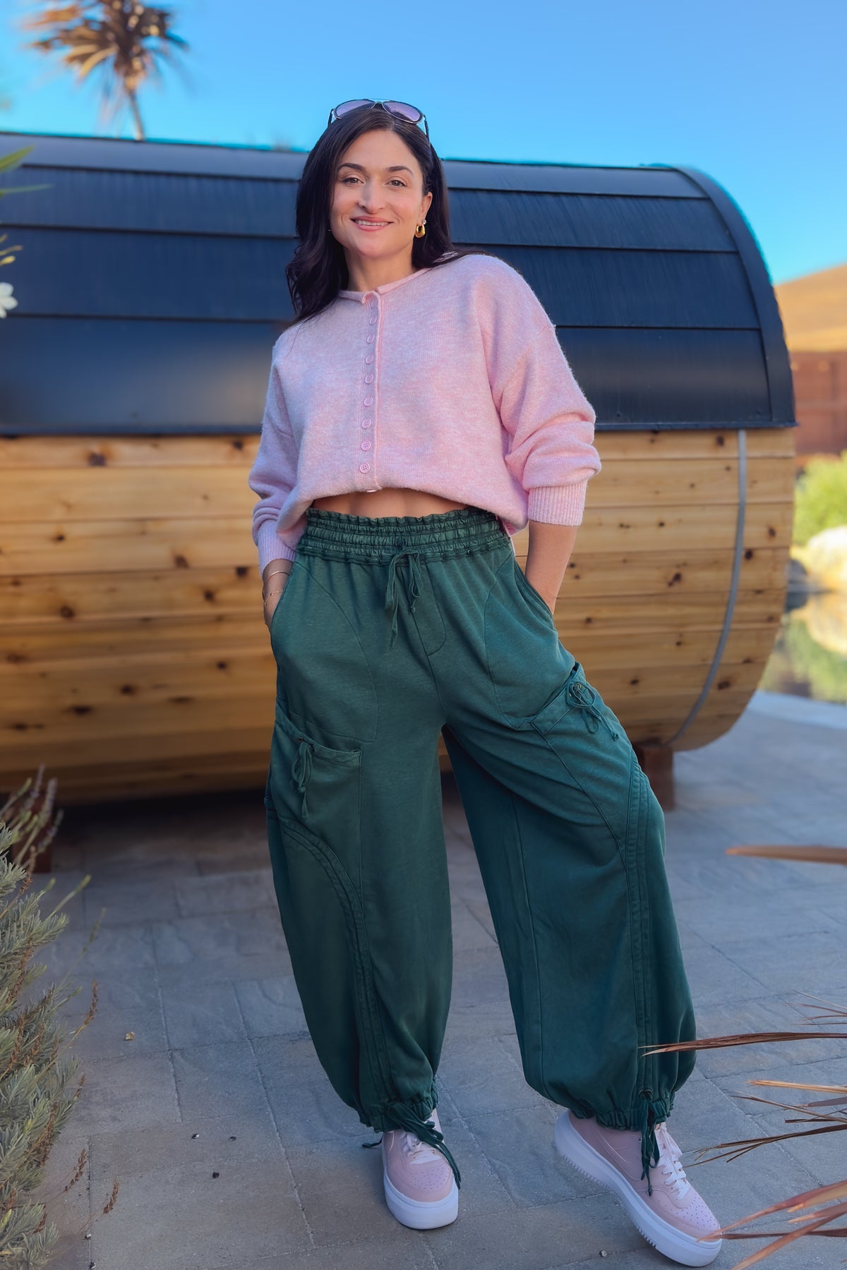 1. Green wide leg cargo pants with oversized utility pockets, elastic waist and ankle drawstrings