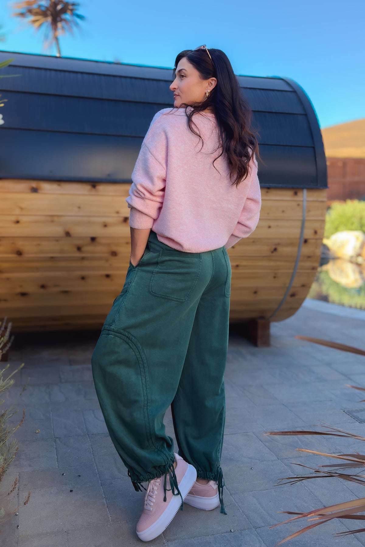 Women’s green mineral wash pants with relaxed fit, drawstring waist and cargo detailing