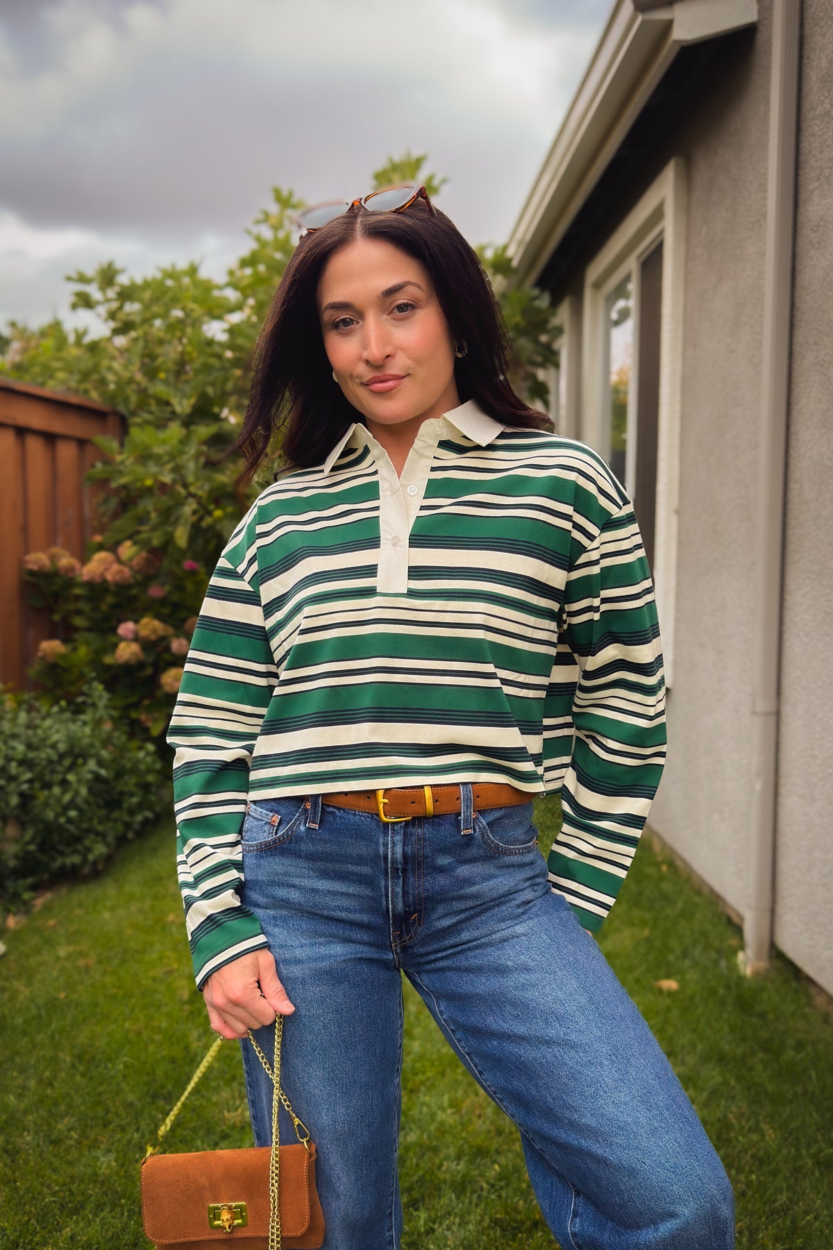 Green navy and ivory rugby polo shirt styled with high rise blue jeans