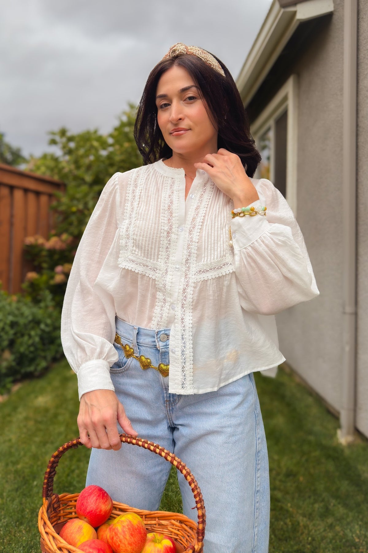 Women’s white pintuck blouse with button front and delicate lace trim