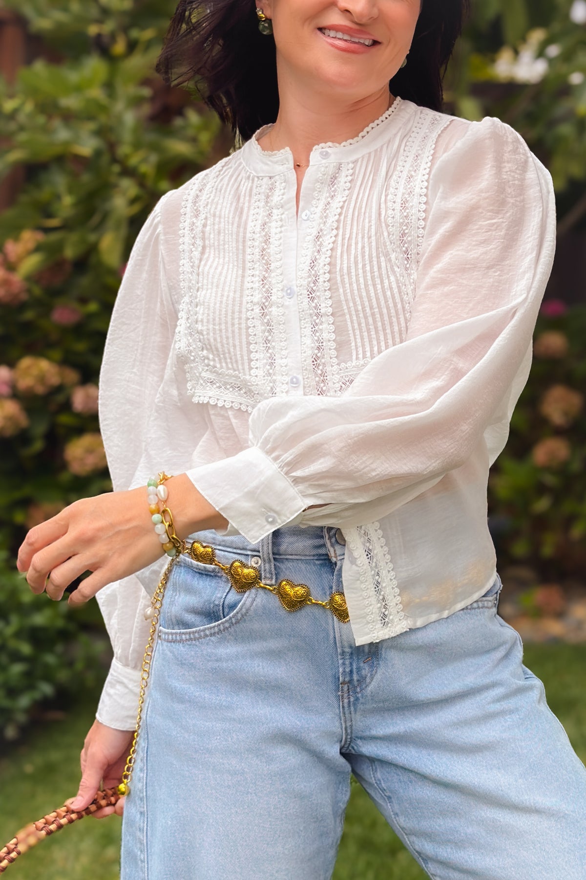 Lightweight white button down blouse with lace details and long bishop sleeves