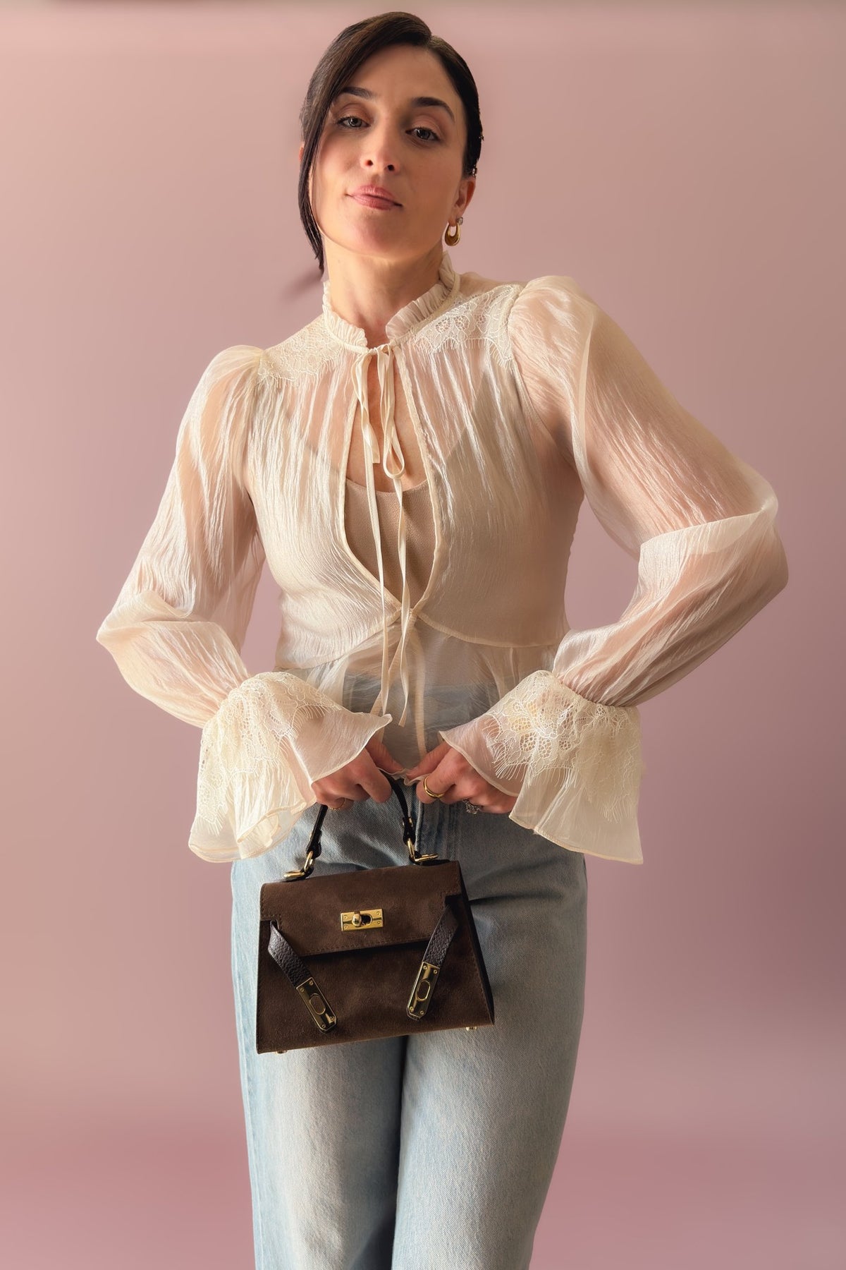 Ivory sheer organza lace trim peplum blouse styled with light wash wide leg jeans