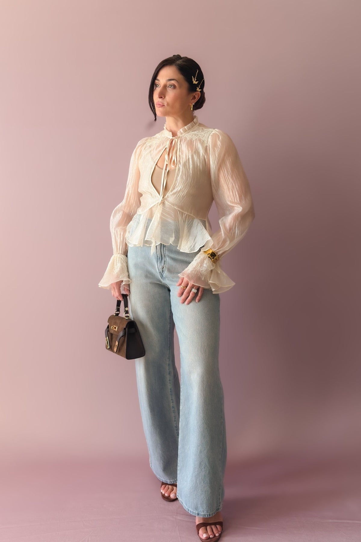 Ivory lace trim blouse with sheer balloon sleeves, ruffled neckline and front tie detail