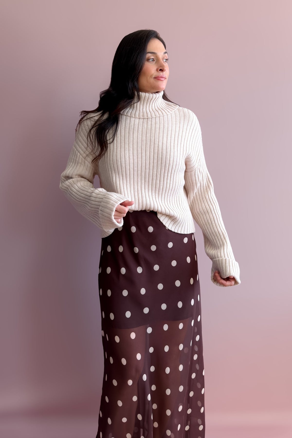 Women’s ribbed beige turtleneck sweater with drop shoulders and lightweight warmth