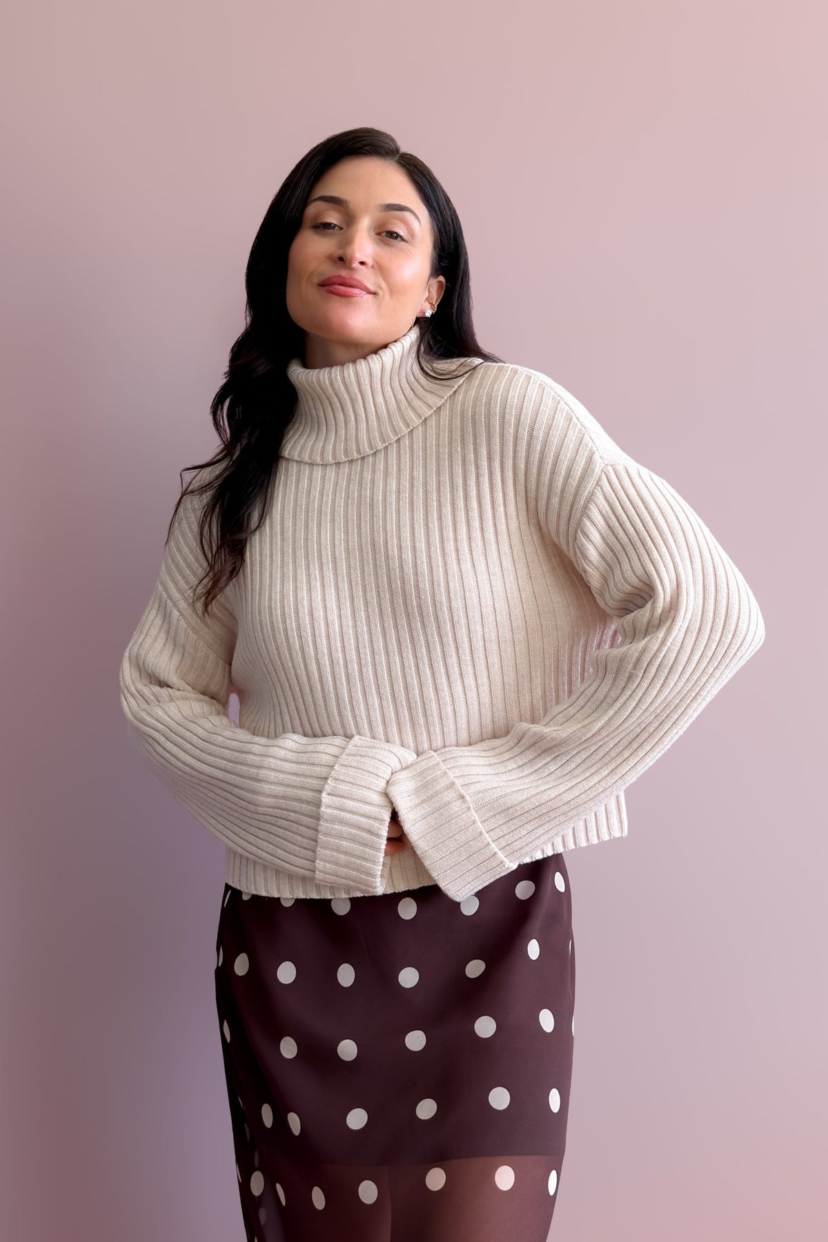 Soft merino blend knit sweater in light beige with relaxed fit and high neckline