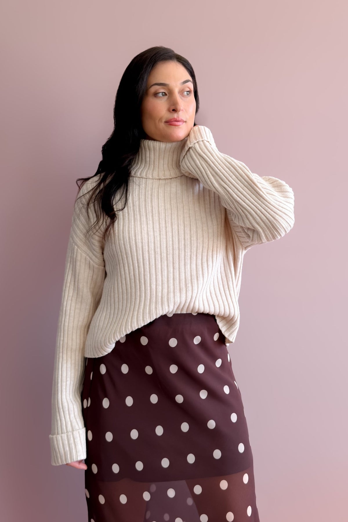 Light beige wool blend sweater with flexible turtleneck and easy layering fit
