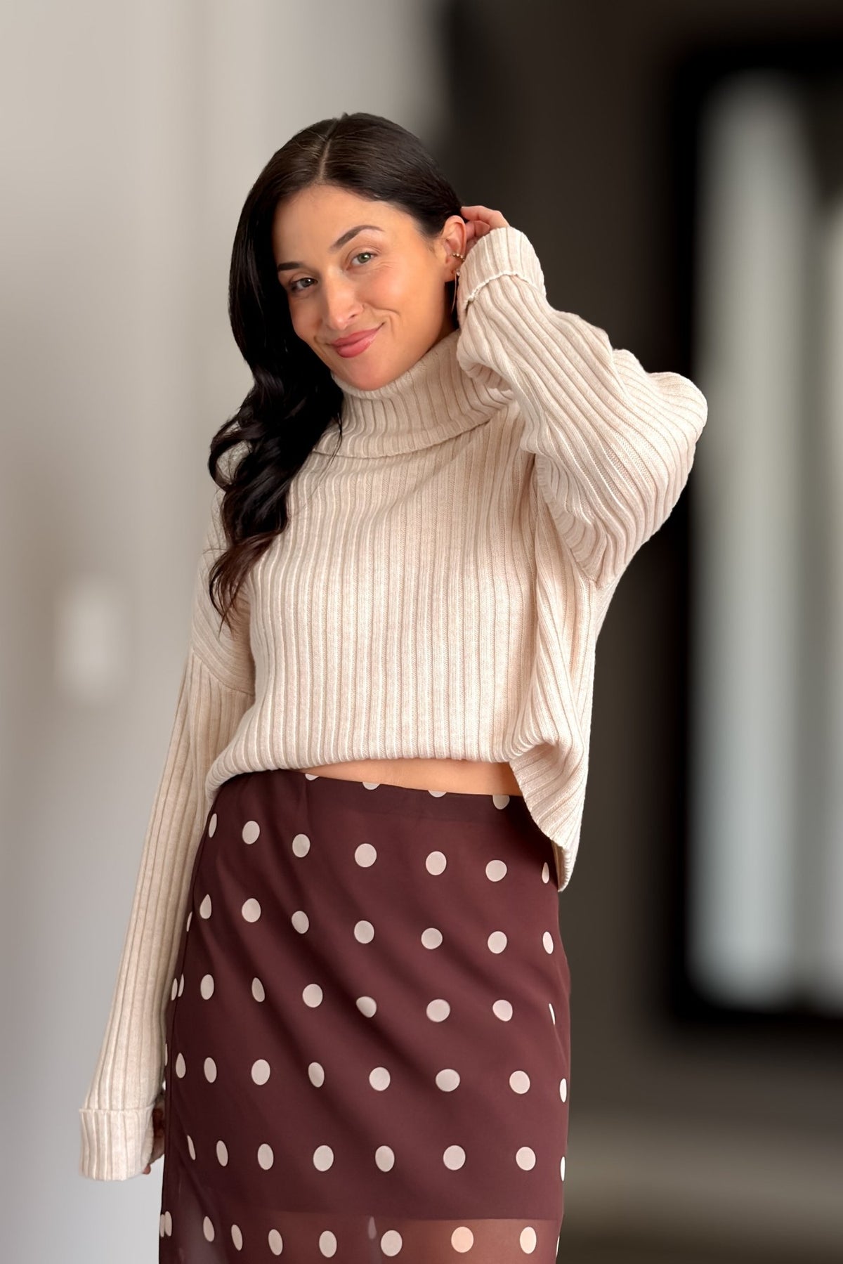 1. Soft neutral turtleneck sweater in a merino wool blend with ribbed texture and relaxed shape