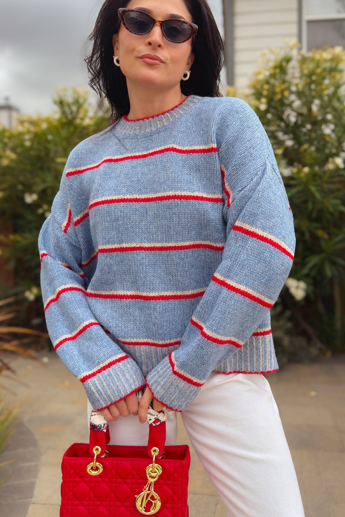 Blue and red striped crewneck sweater with long sleeves and ribbed trim