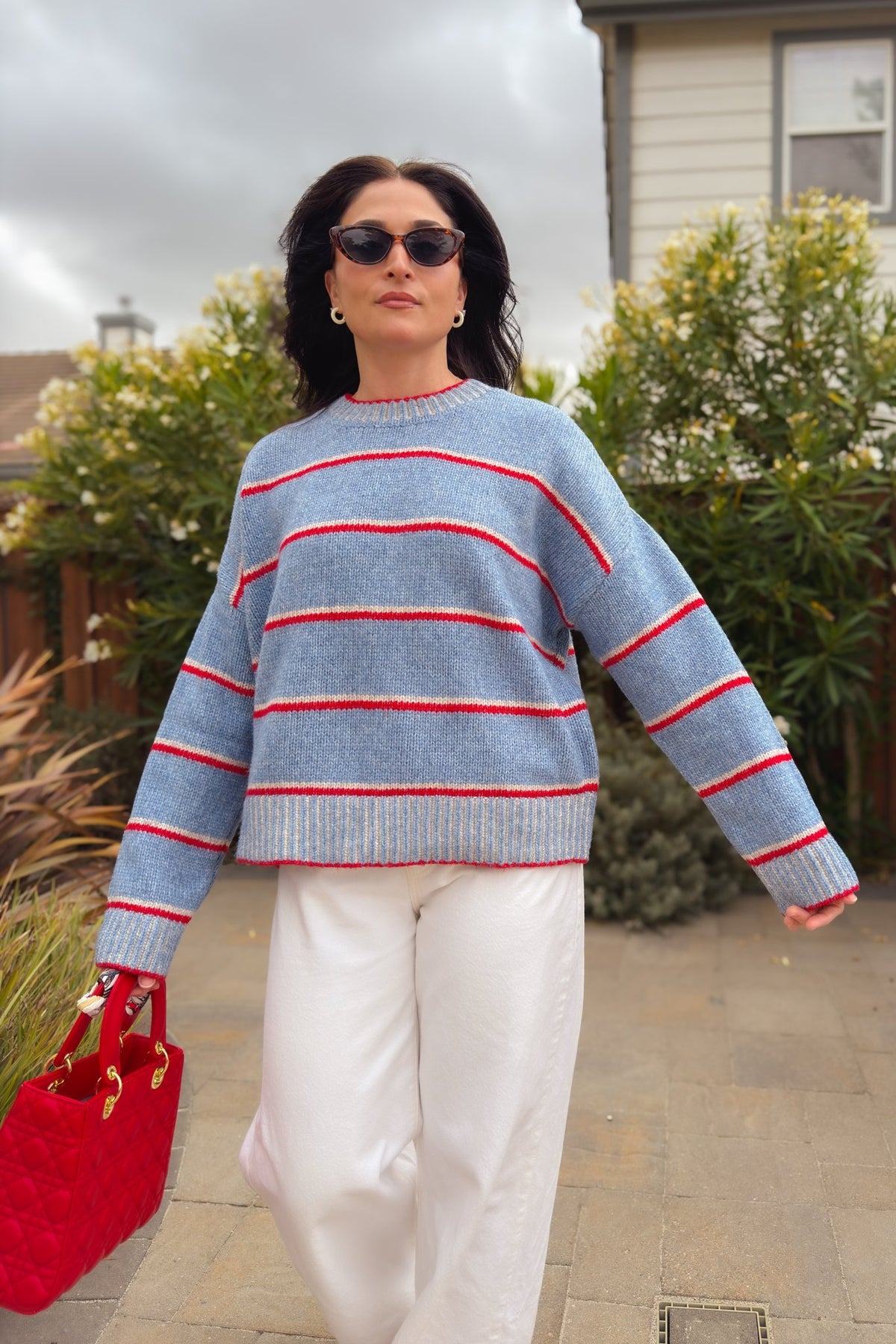 Light blue and red fall sweater with relaxed fit and drop shoulder design