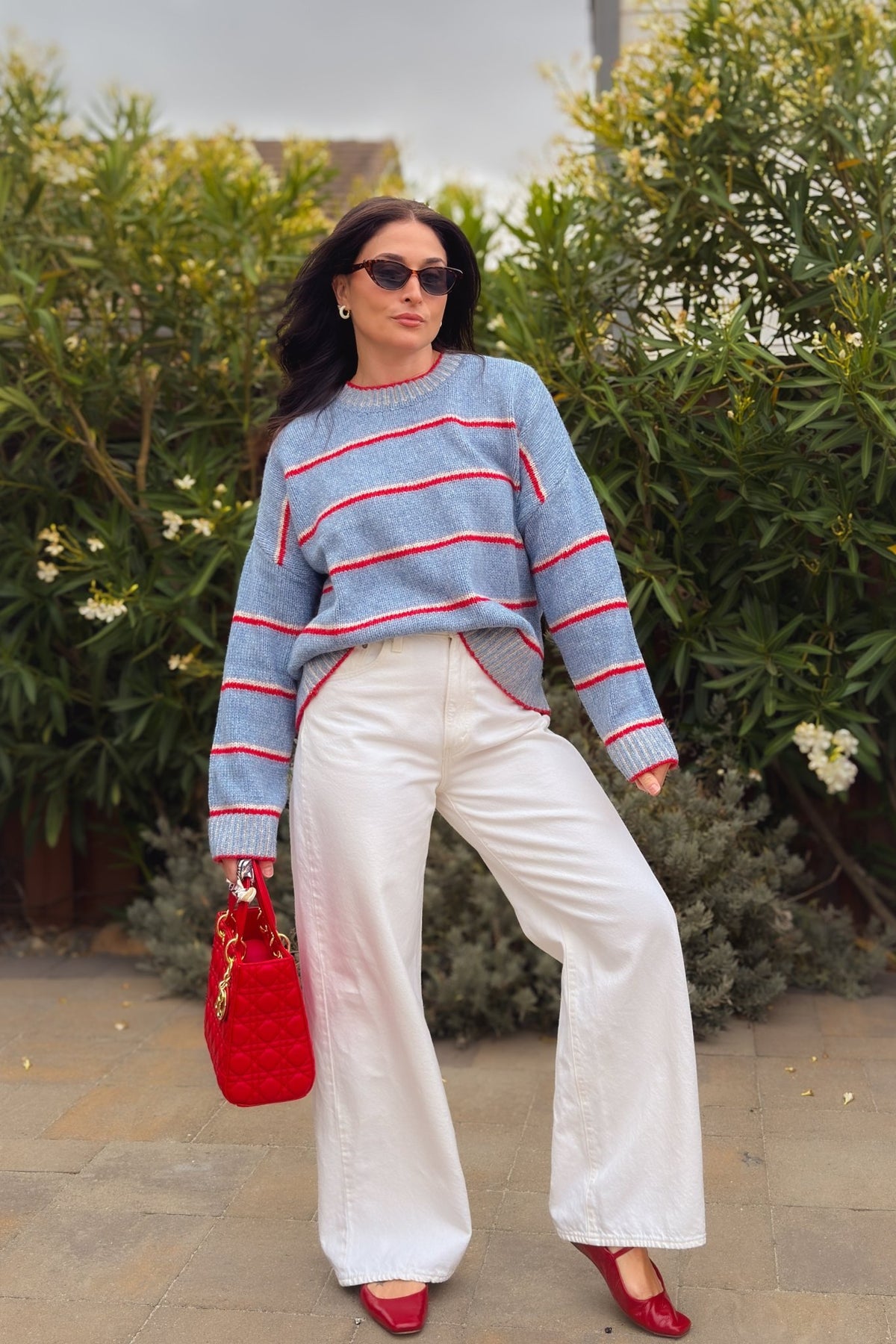 Striped oversized crewneck sweater with light blue base and red trim