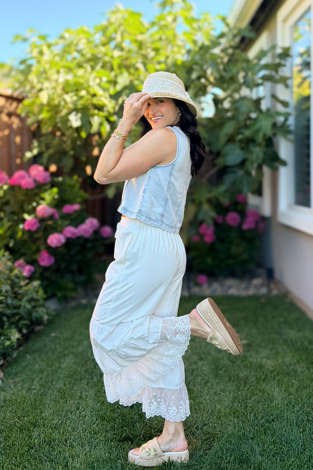 Soft lightweight denim-look tank top styled with a white maxi skirt and summer accessories.