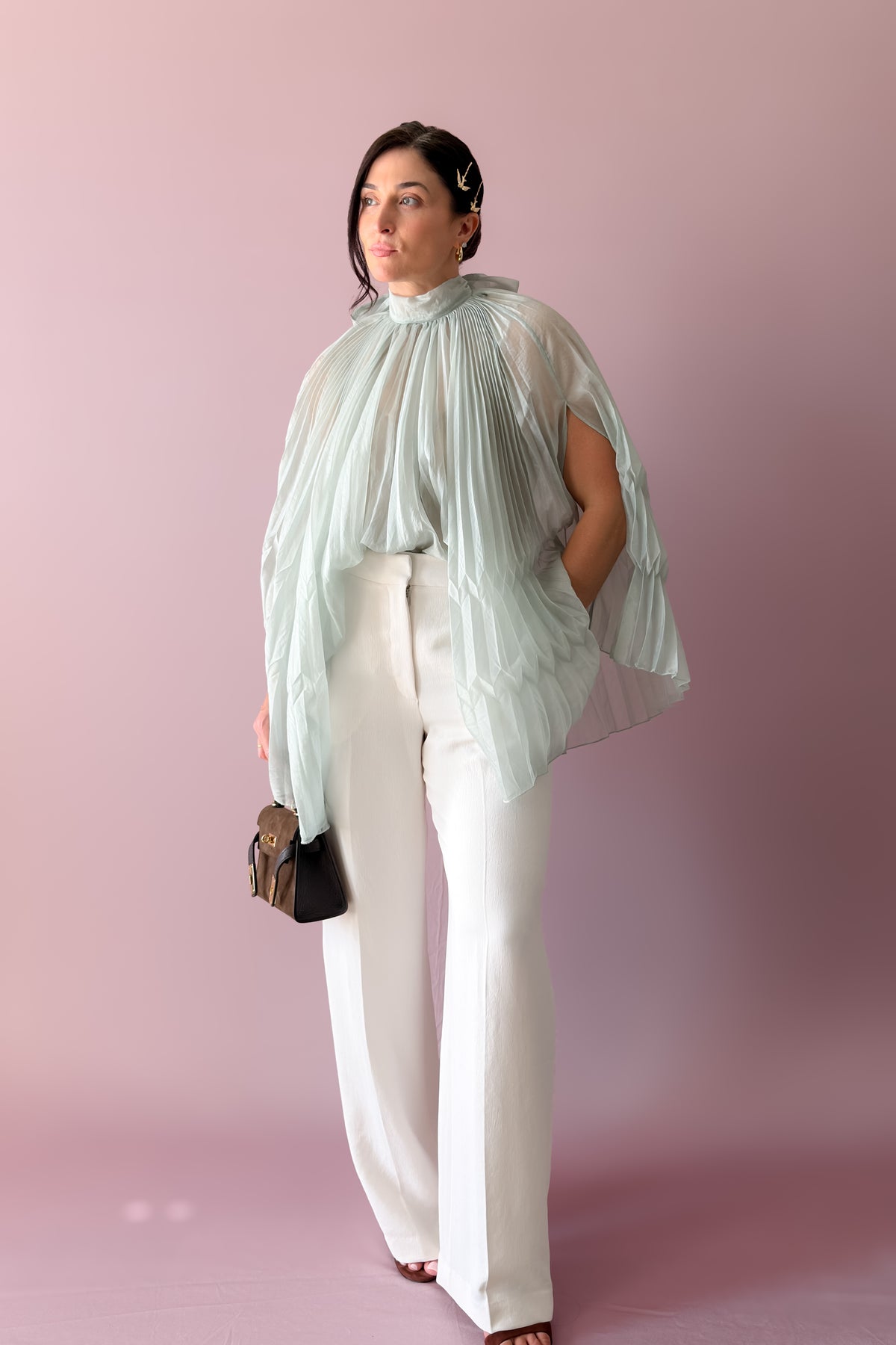 Mint pleated cape top and tiered maxi skirt styled with the bow tied at the back