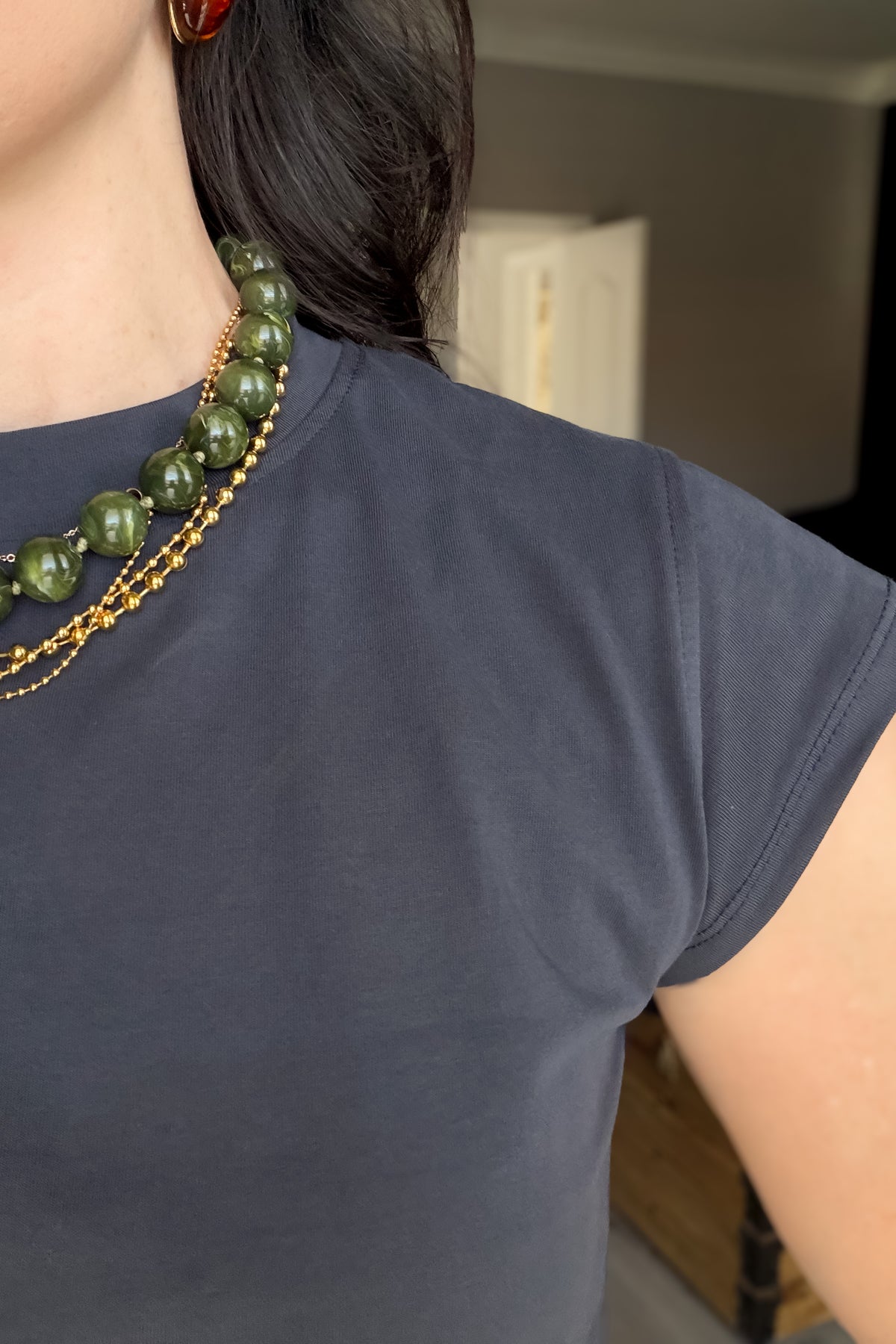 Soft navy blue everyday tee with a crew neckline, cap sleeves and a flattering hip-length fit.