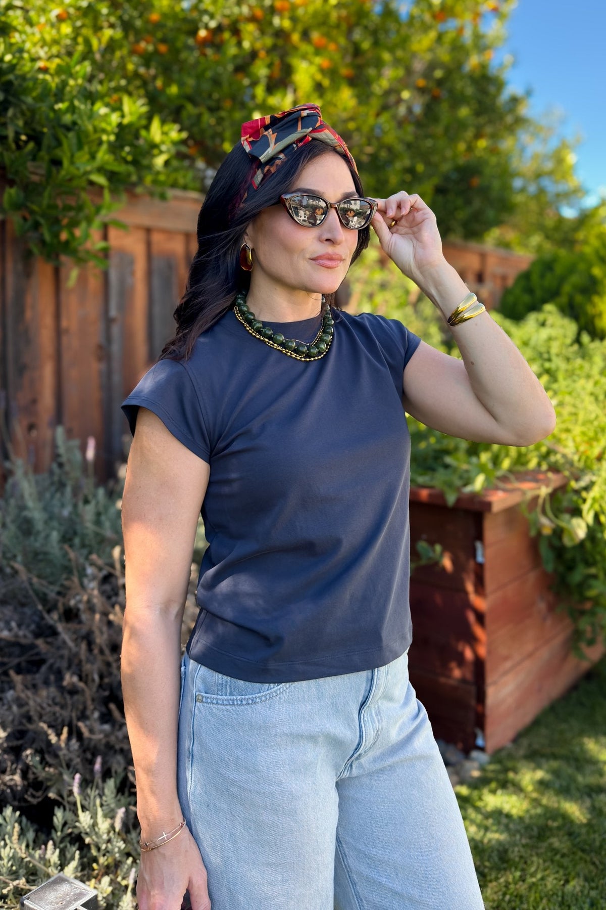 Elevated navy blue crewneck tee with a smooth finish and softly structured sleeves.