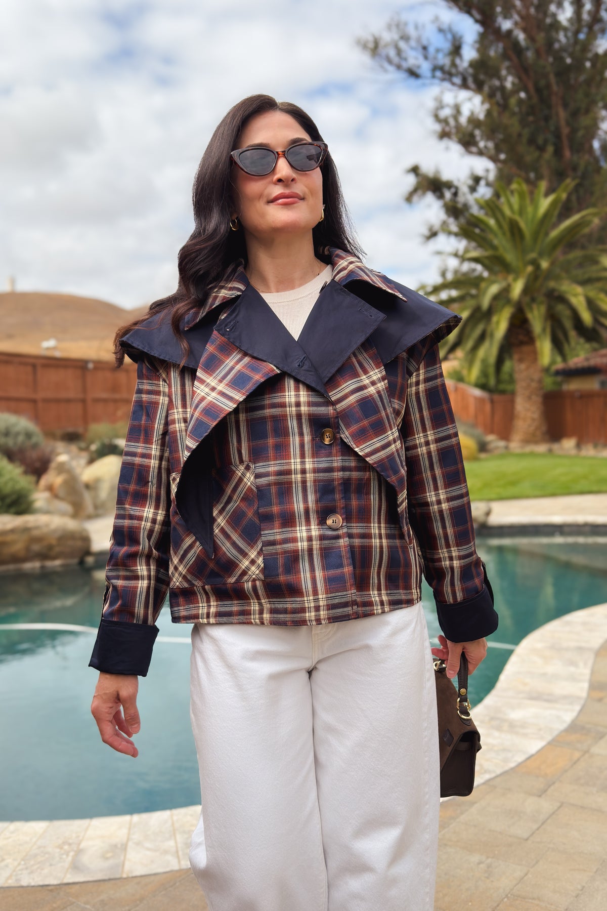 Reversible navy and brown plaid fall jacket for women styled with white denim and boots