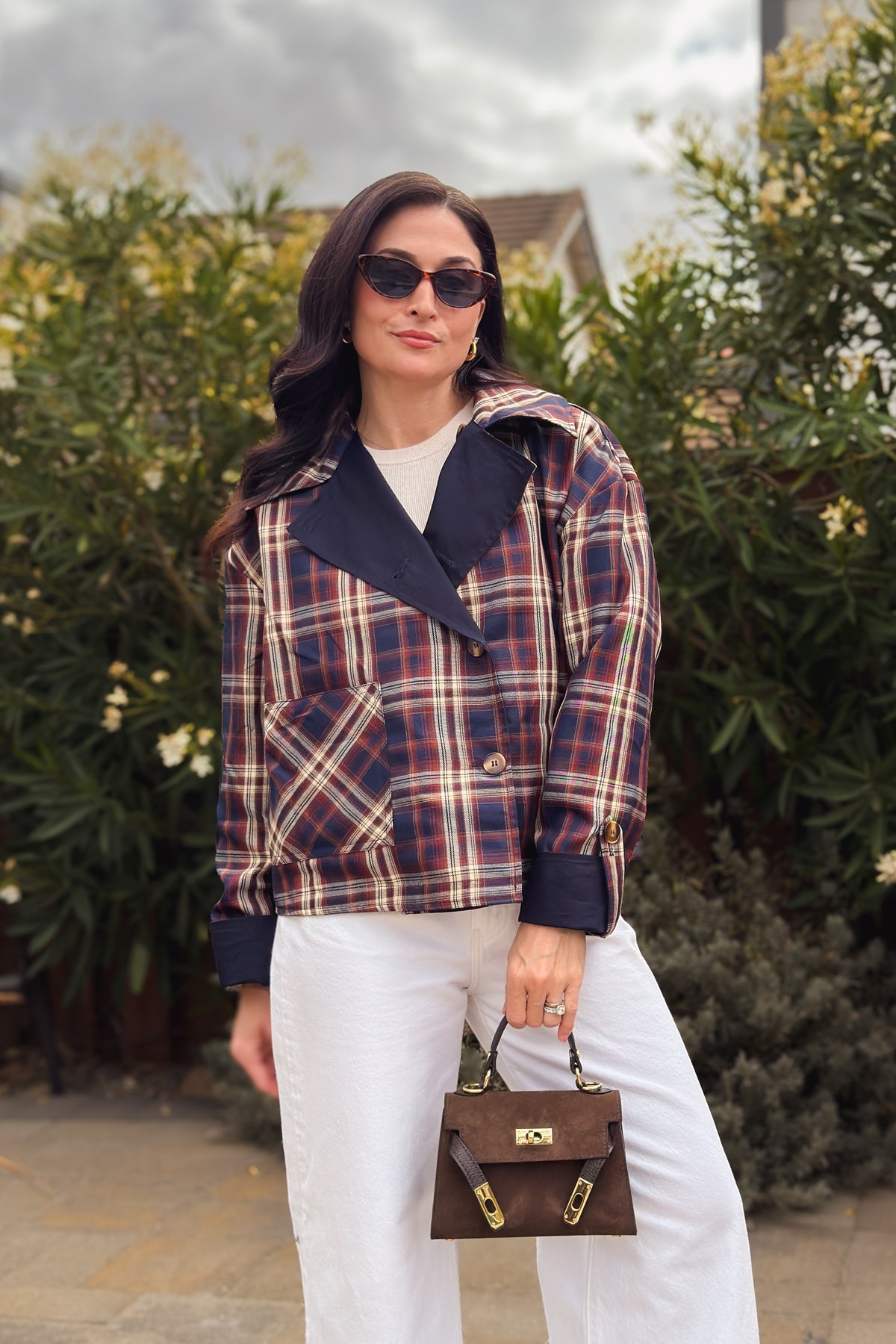 Reversible plaid cotton jacket for women with navy solid side, brown plaid side, and removable cape