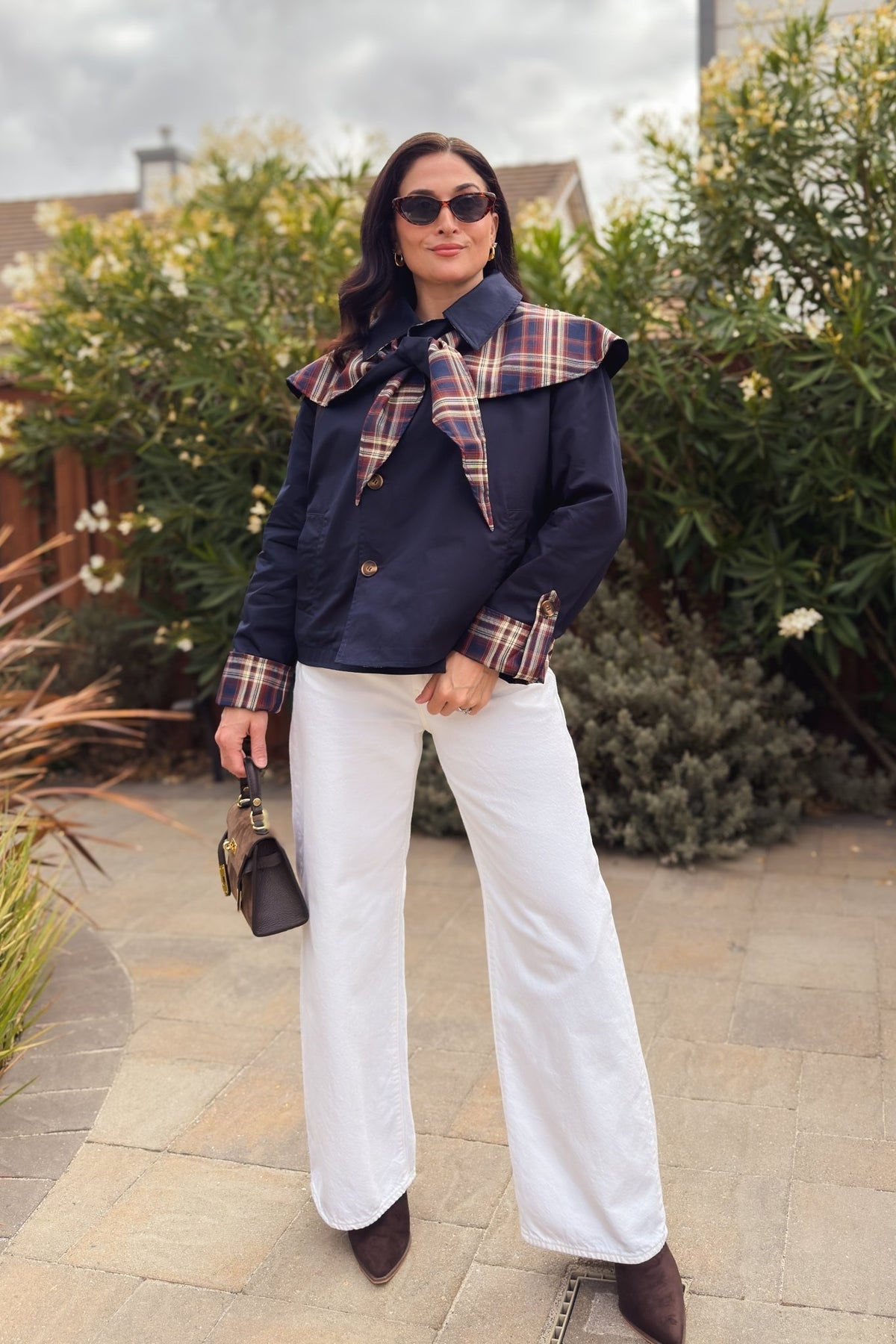 Navy plaid reversible women’s jacket with brown and cream check pattern and removable cape
