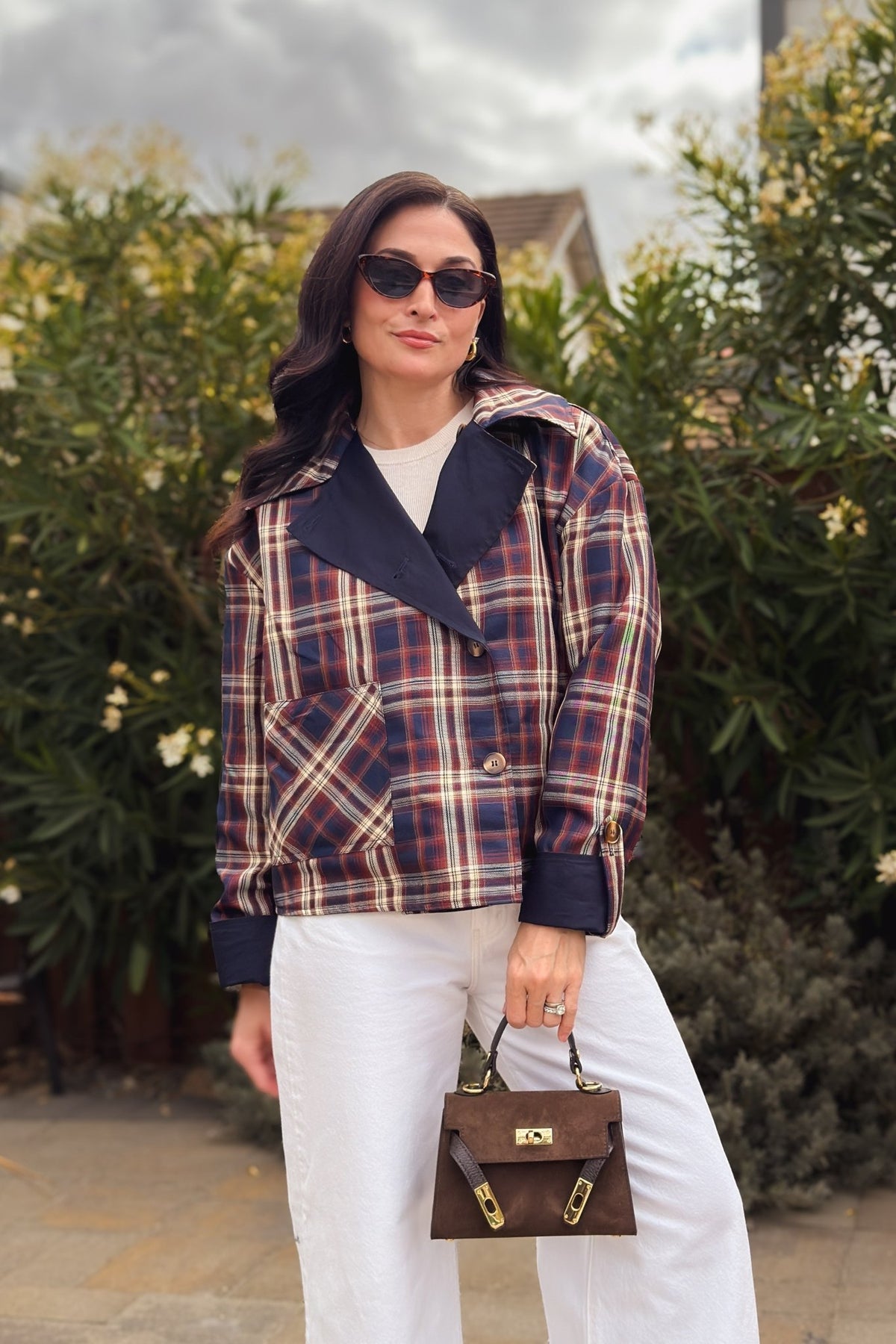 Reversible plaid cotton jacket for women with navy solid side, brown plaid side, and removable cape