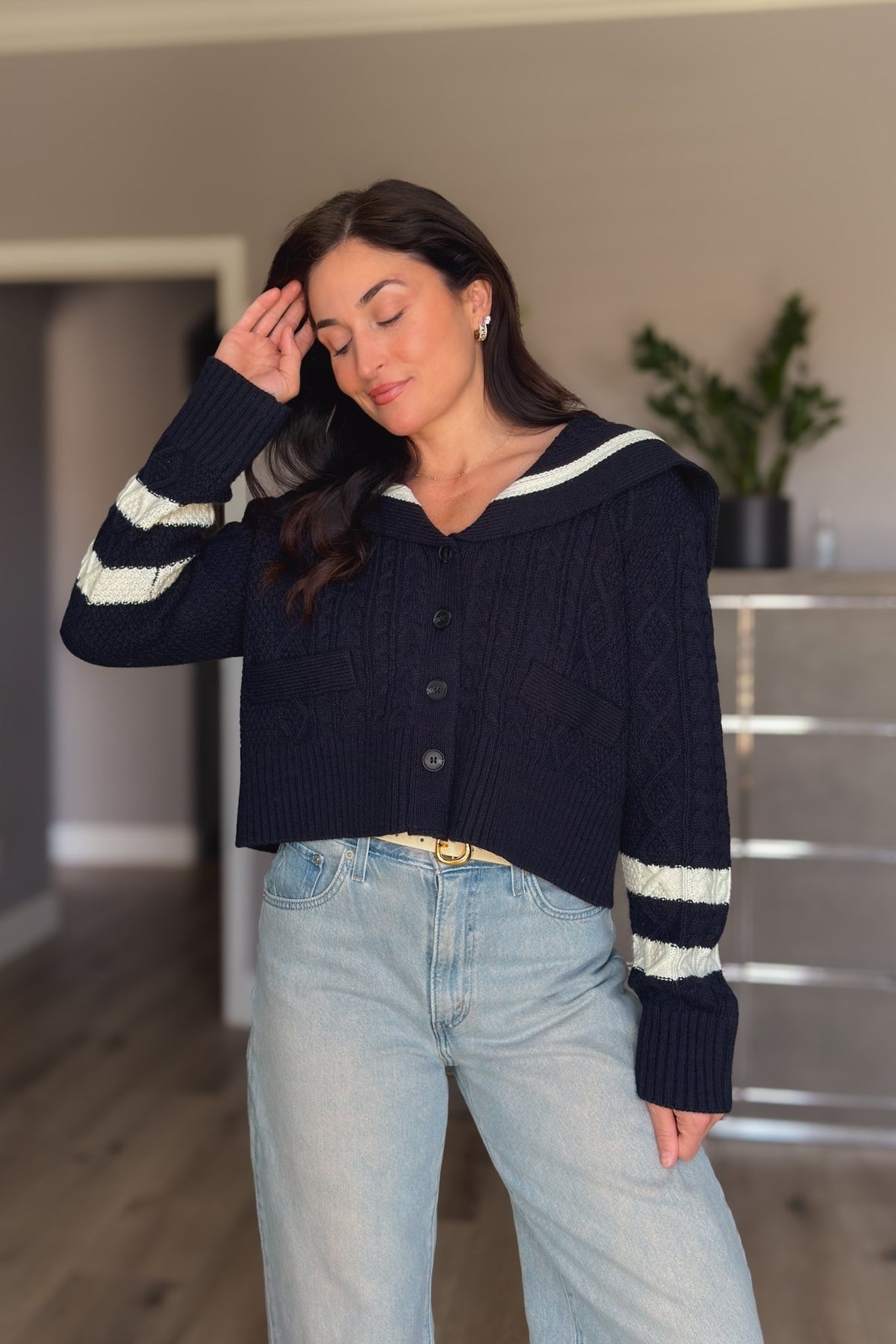 Navy cable knit cardigan for women with ivory striped cuffs, sailor collar, front buttons and cropped relaxed fit.