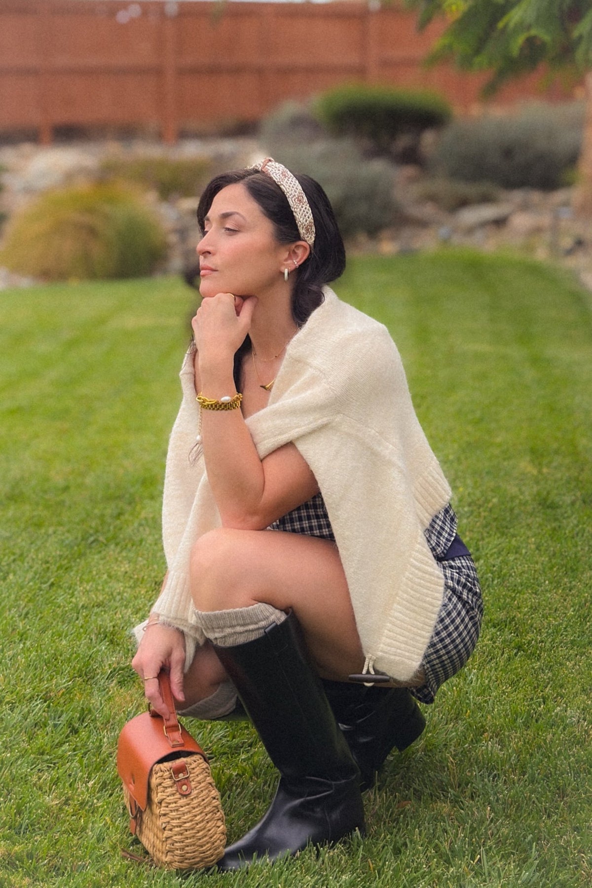 Side view of navy and ivory plaid cami and shorts set showing the relaxed top, adjustable straps and coordinating plaid shorts.