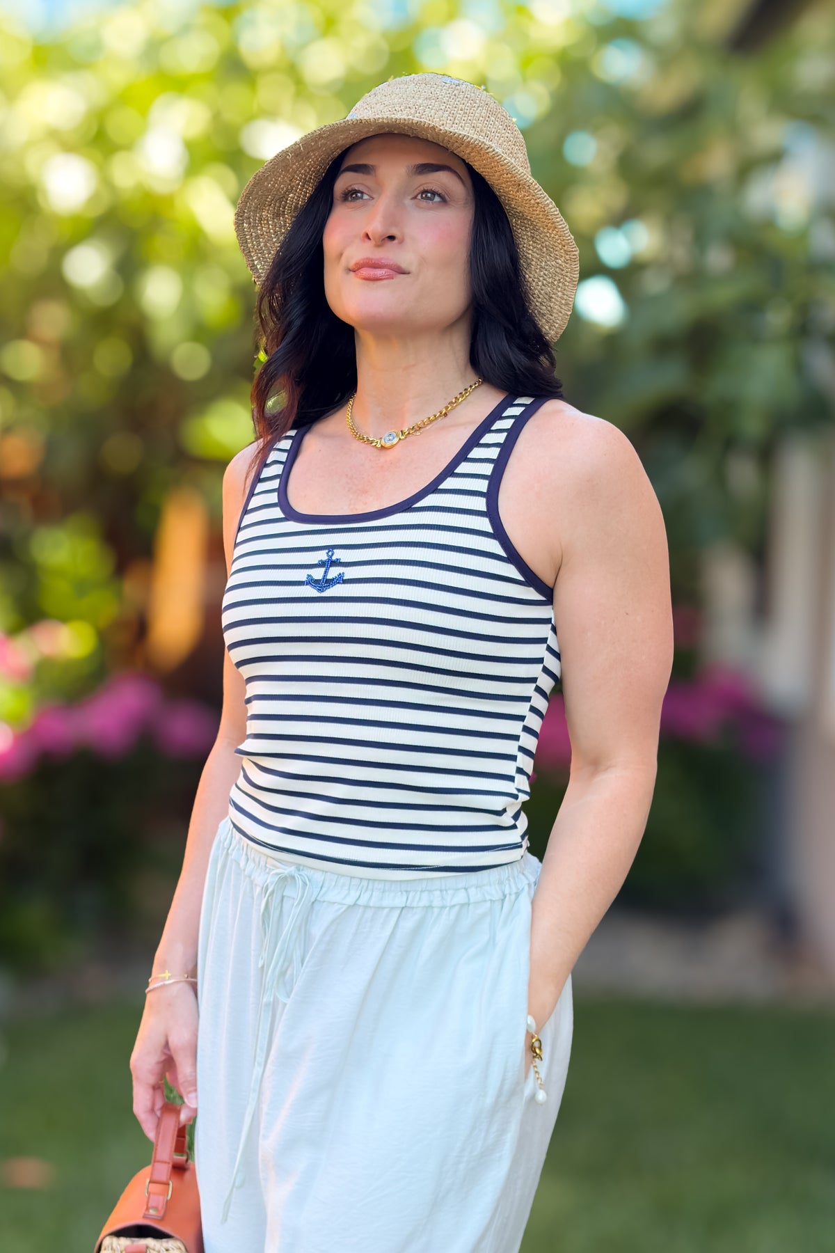 Women's navy striped tank top with embroidered anchor detail and relaxed summer styling
