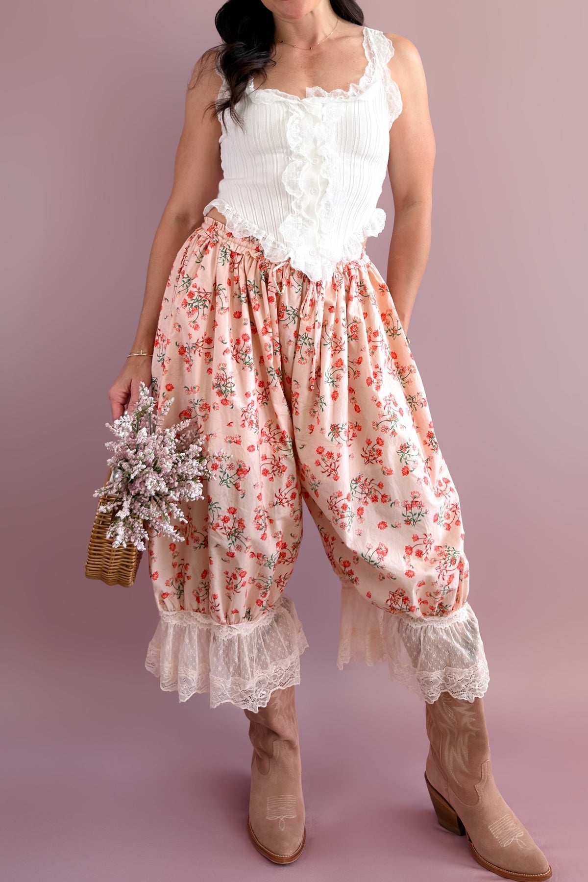 Romantic floral outfit with a white lace tank, pink floral bloomer pants, and wicker basket filled with flowers