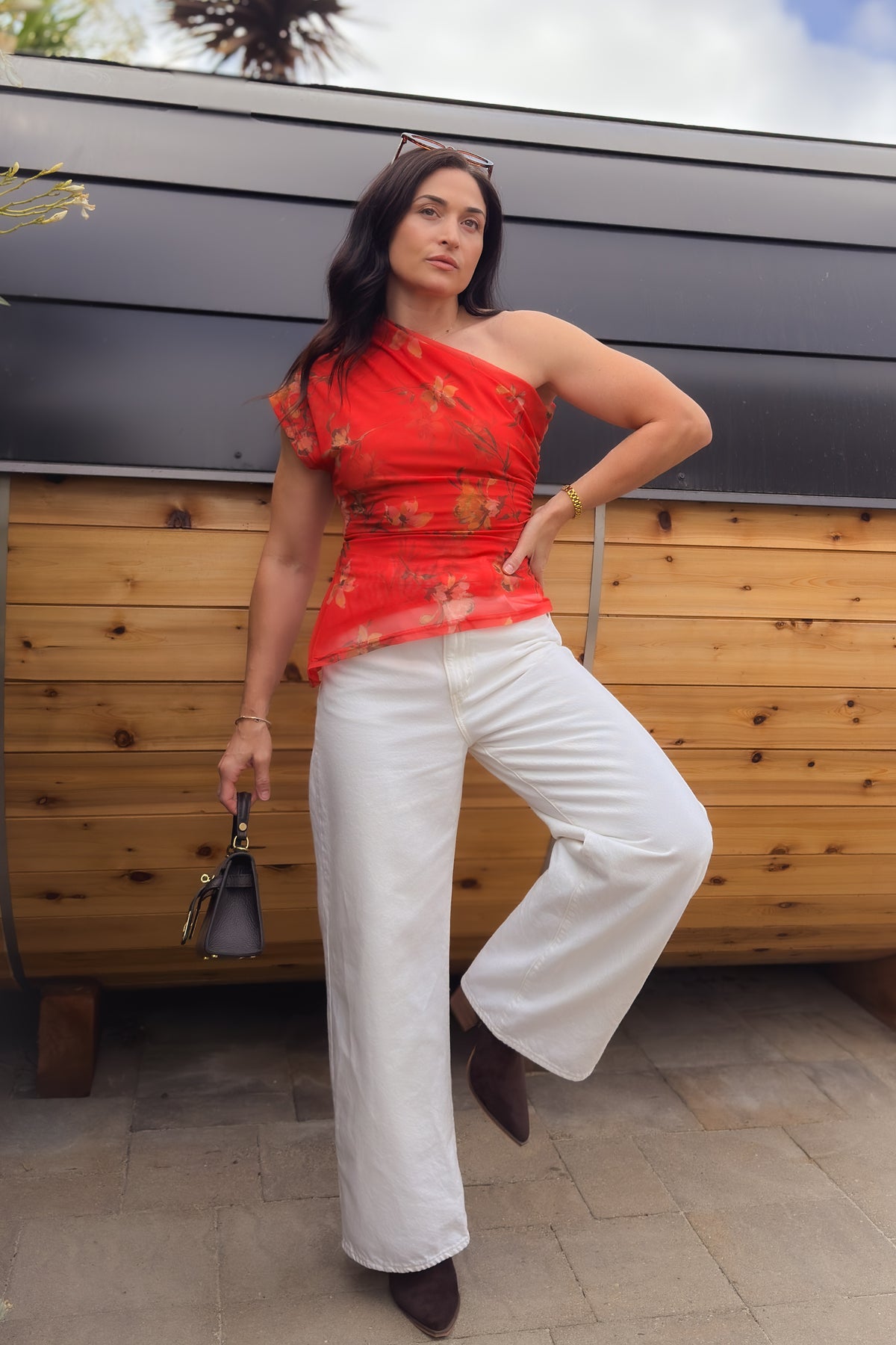 Women’s asymmetrical red floral top with double layered mesh and side ruching