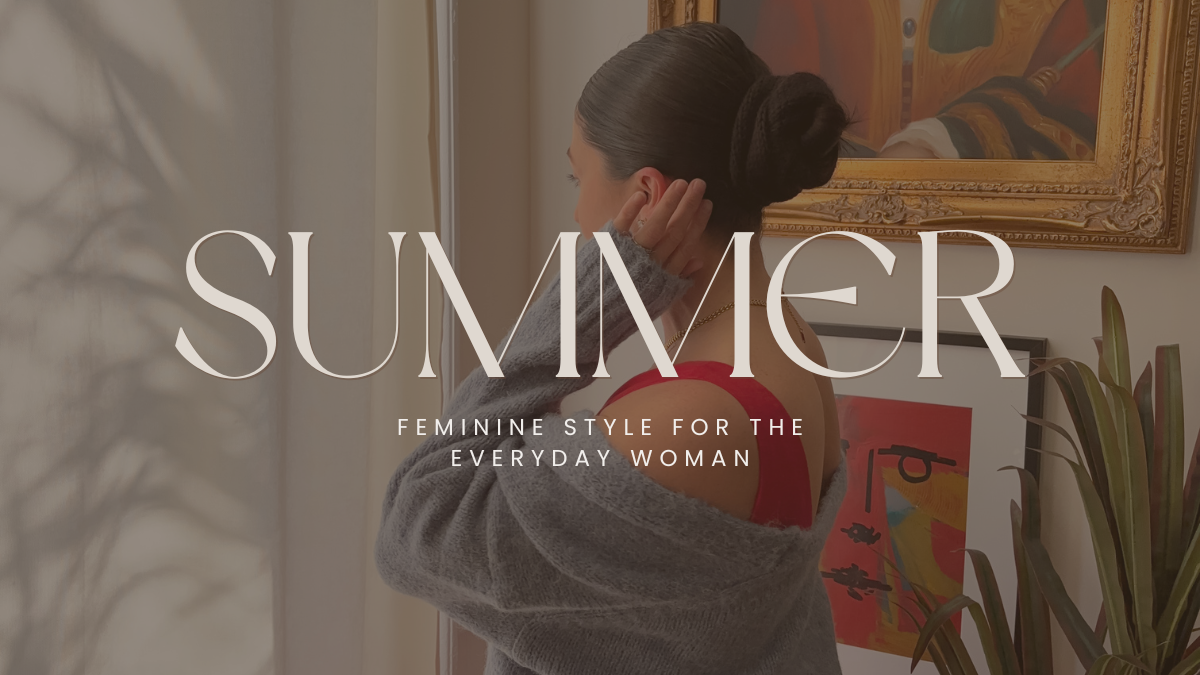 Woman wearing a red dress with a gray sweater draped off the shoulder, standing by a window with sunlight streaming in. Behind her is a framed painting and houseplant. Overlay text reads "SUMMER – Feminine Style for the Everyday Woman.